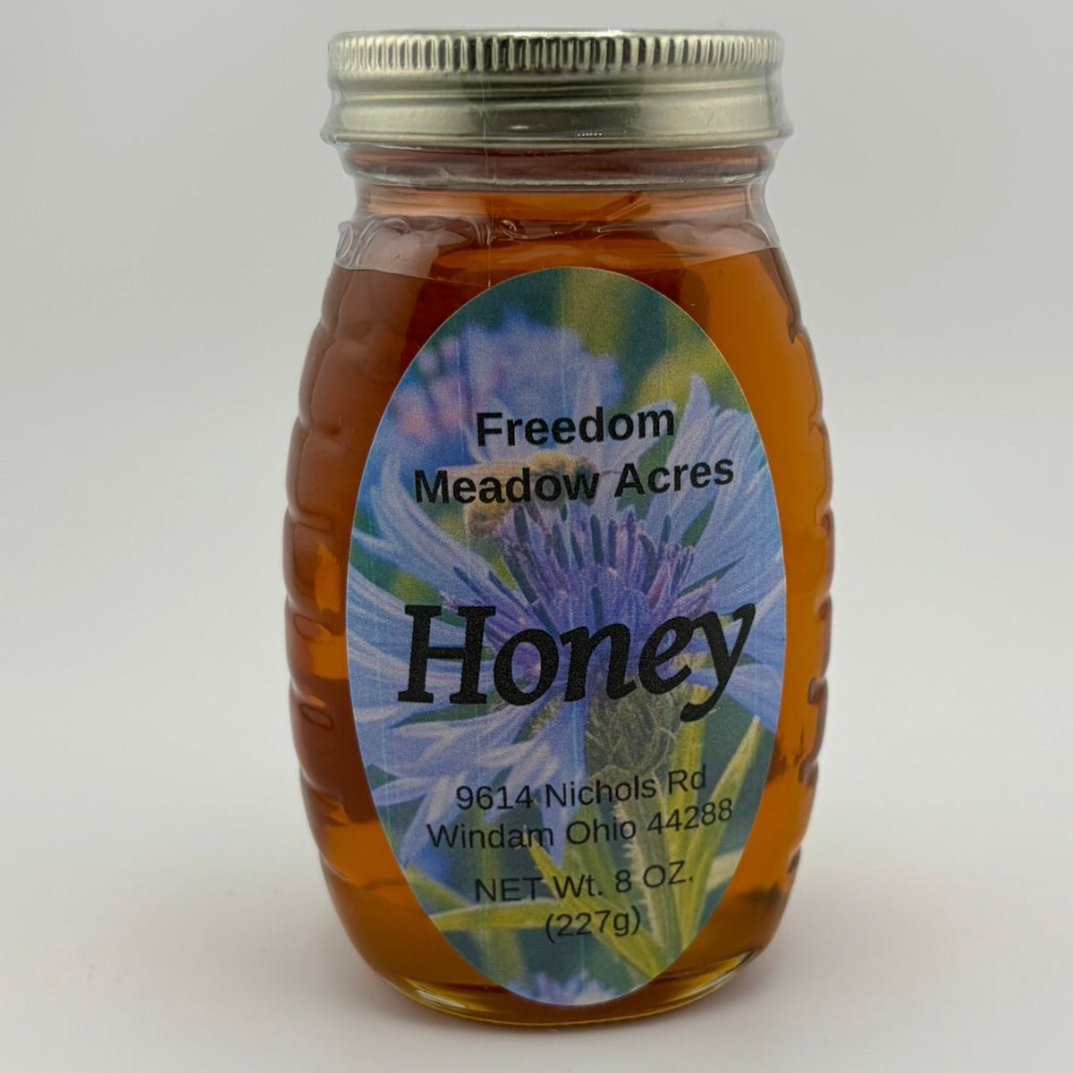 An 8 oz jar of honey.